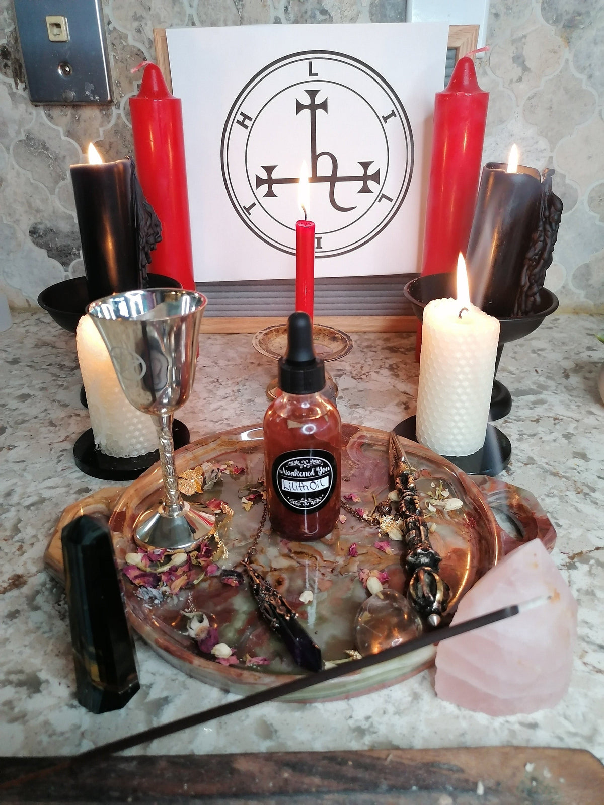 Lilith altar with candles and a chalice